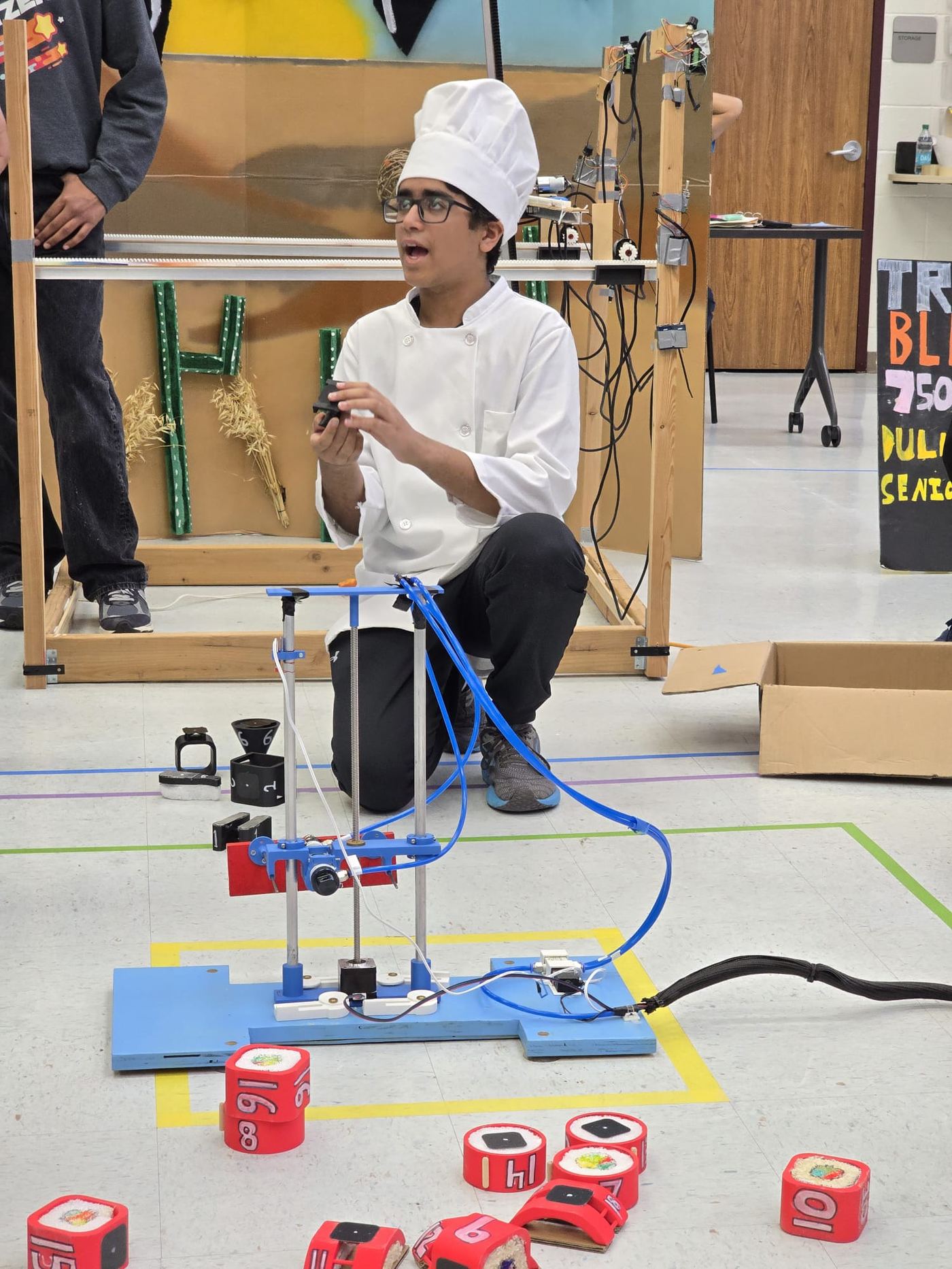 Rishaan of Trailblazers DI: the autonomous music conductor gimmick and costumes, "Breaking Point" Technical Challenge (2024-25 Season), photo 1 of 4
